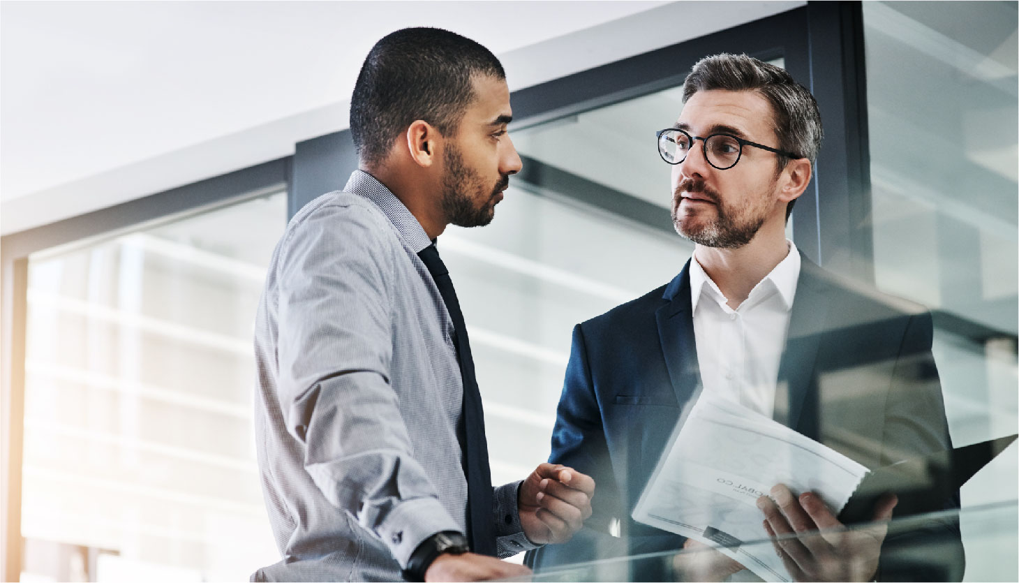 Two businessmen in the office talking